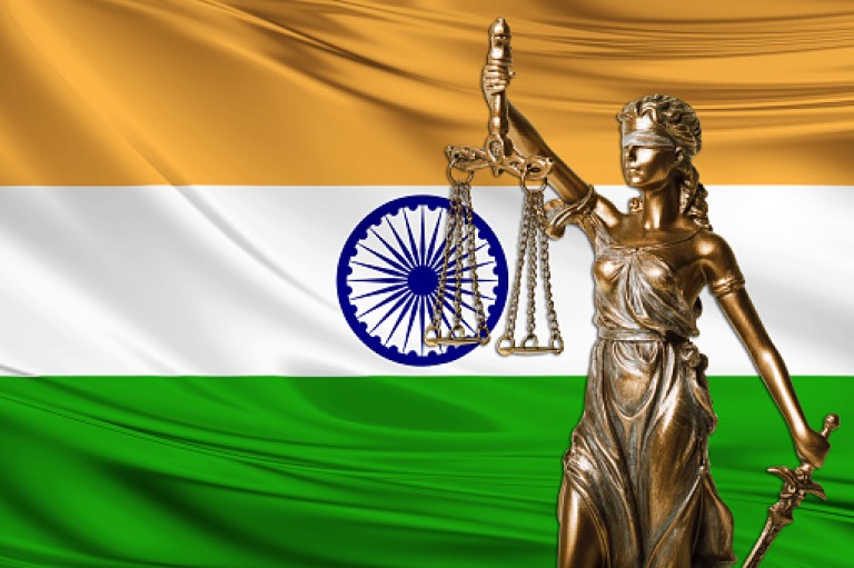 india flag and statue of blind lady justice ( themis )